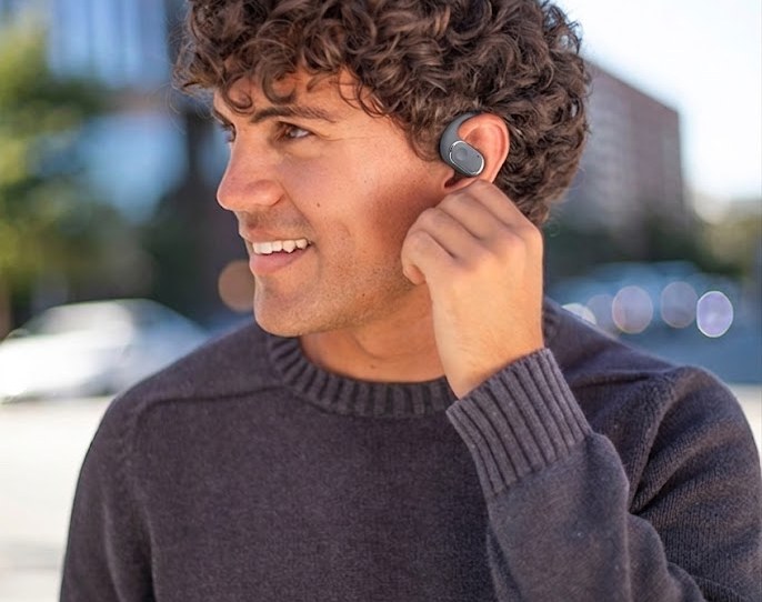 Man wearing Groovz open-ear headphones