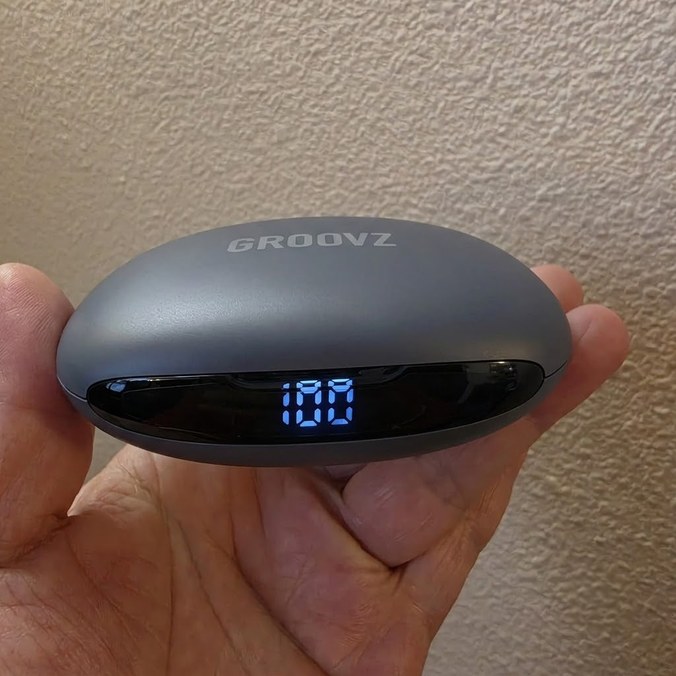 Groovz grey charging case held in hand